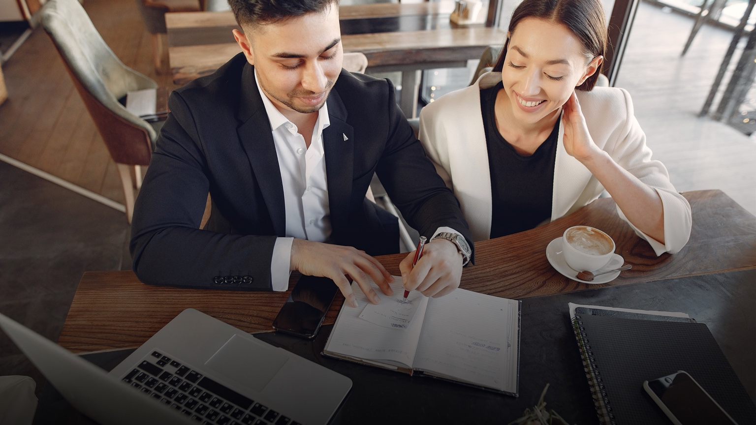 A couple discussing financial plans with an advisor